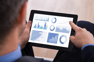 Businessman Analyzing Graph On Digital Tablet