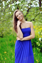 Fototapeta premium Young smiling woman outdoors portrait