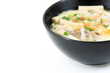 Bowl of Vietnamese pho bo,noodle soup served with onions and cil