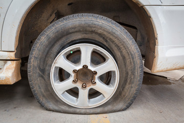 flat tyre on old car wheel