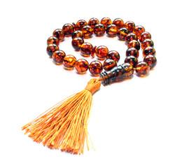 Baltic amber islamic rosary isolated on white