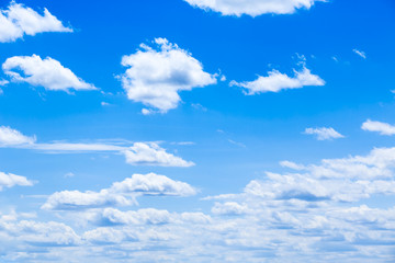 White fluffy clouds in the blue sky