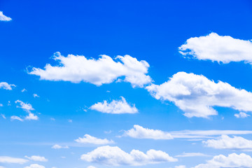 Naklejka na ściany i meble White fluffy clouds in the blue sky