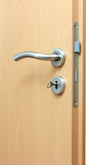 Modren style door handle on natural wooden door.