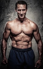 Obraz na płótnie Canvas Middle-aged man with muscular body