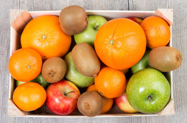 a small wooden crate with fruits