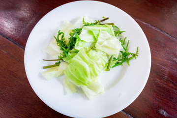 boiled vegetables in dish.