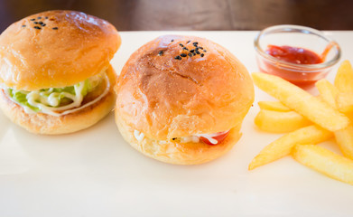 homemade hamburger with fresh vegetables and French Fries