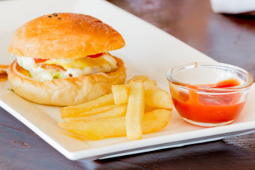homemade hamburger with fresh vegetables and French Fries