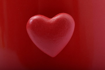 Red heart on red background