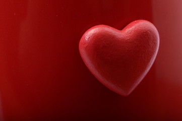 Red heart on red background