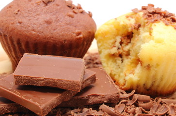Fresh baked muffins, grated and portion of chocolate