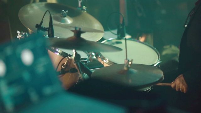 Drummer playing drum set. Close-up