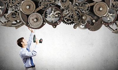 Businessman with drill