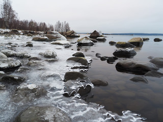 stones in the ice on the lake