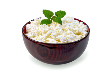 Curd in wooden bowl with mint