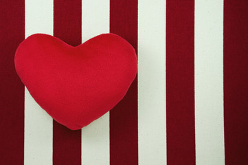 Valentine heart on white and red striped fabric