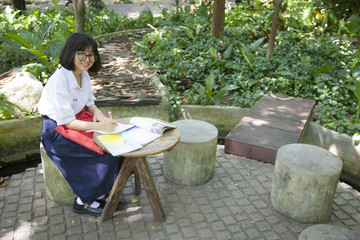 Girl reading and homework.