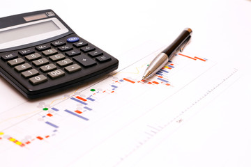 Naklejka na ściany i meble Business abstract - calculator and elegant pen on finance chart.