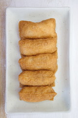 Sushi flavored boiled rice wrapped in fried tofu