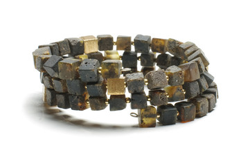 Dark amber cube armlet isolated on the bright background