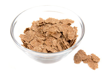 Cereals in glass bowl on white background