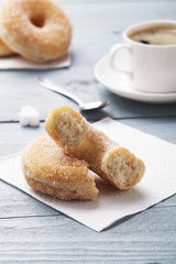 Fresh donut served with a cup of coffee
