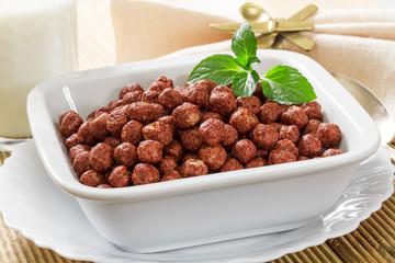 Cereal chocolate balls on wooden table