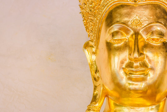 Closeup of the face of buddha's image .