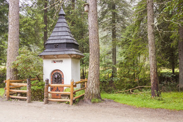 Small white shrine on trail in Koscieliska valley.