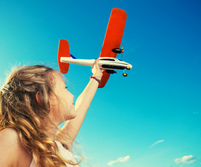 Girl playing with plane