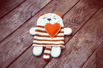 panda with heart on wooden background