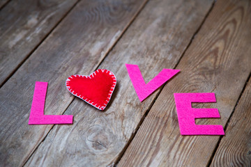 red heart and love on the wooden background