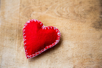 red heart on the wooden background