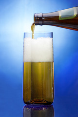 Glass and bottle with beer