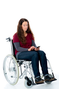 young woman in wheelchair with smartphone