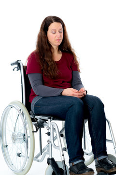 sad young woman in wheelchair