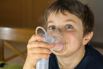 child taking respiratory, inhalation therapy