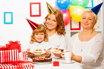 Family at little girl's birthday party
