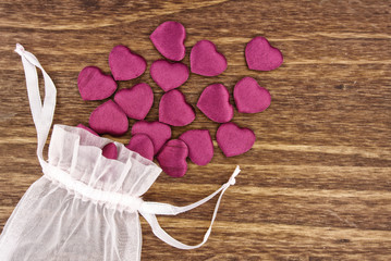 Small Fabric Hearts Spilling Out of a Pouch