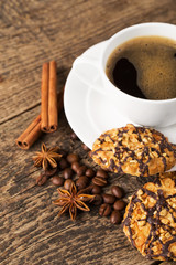 coffee and cookies on wood background