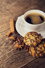 coffee and cookies on wood background