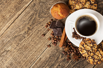 coffee and cookies on wood background