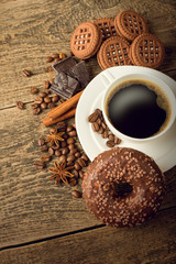 coffee and cookies on wood background