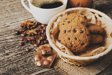 coffee and cookies on wood background