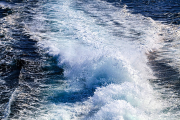 High waves on the water surface after ship