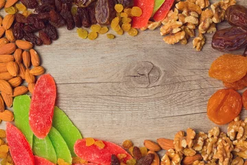 Fototapeten Background with assorted dry fruits and nuts © maglara