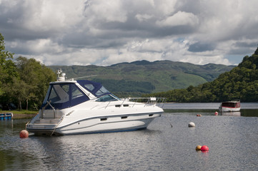 Fototapeta na wymiar Motorboat moored in Luss Loch Lomond