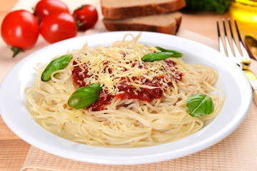 Pasta with tomato sauce on plate on table close-up