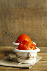 Ripe sweet persimmons, on wooden table